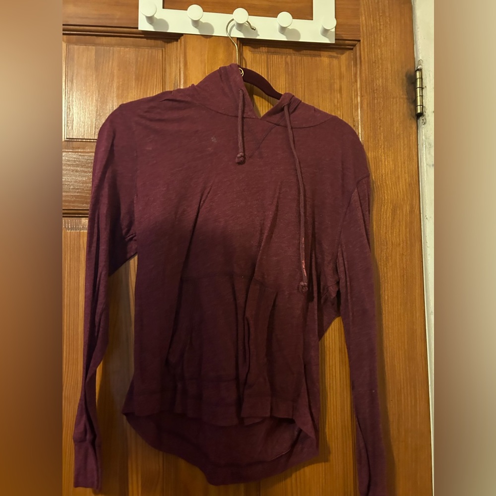 This top is a hoodie. It is very light.